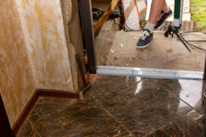 Handyman Installing a door sweep